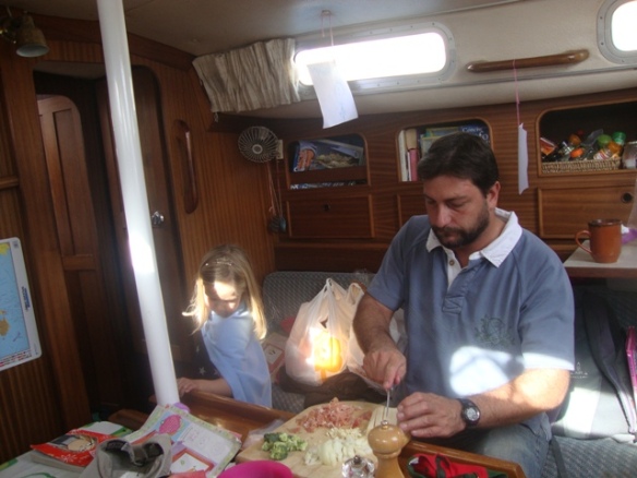 Lily, in princess garb, and Julian preparing lunch.