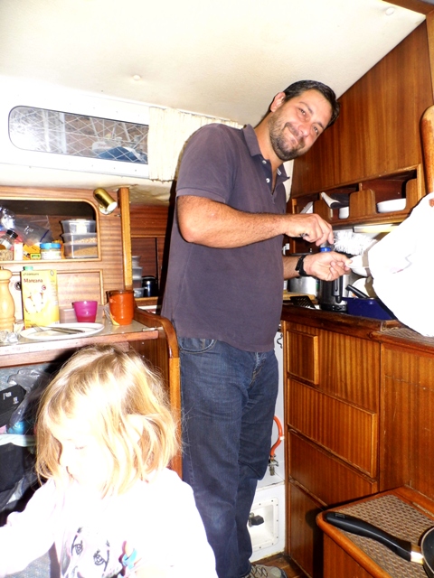 Julian in our tiny (and not very lofty) galley